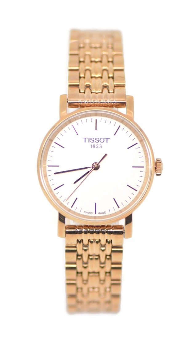Tissot Gold Tone Stainless Steel Quartz Wristwatch with Box and Papers: Tissot Gold Tone Stainless Steel Quartz Wristwatch with Box and Papers This Tissot Gold Tone Stainless Steel Watch is a sophisticated wristwatch featuring a precise quartz movement. It showcases a cla