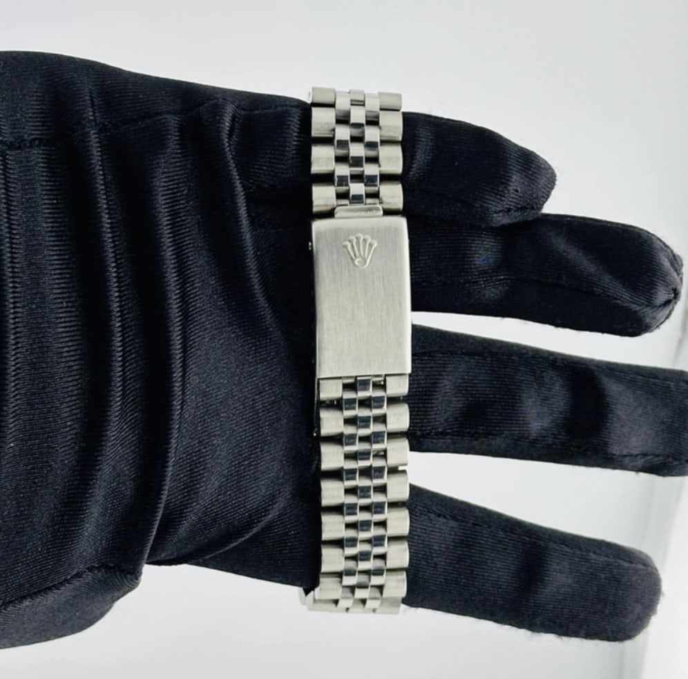 Rolex Datejust 16014 Silver Stick Dial Jubilee Bracelet: Rolex Datejust 16014 Silver Stick Dial Jubilee Bracelet This Rolex Datejust features a silver stick dial, fluted bezel, and is fitted with an aftermarket Jubilee bracelet. The watch is identified by r