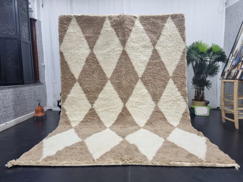 Authentic Moroccan Handmade Rug White Brown Geometric Design 100 Wool: Authentic Moroccan Handmade Rug White Brown Geometric Design 100 Wool This stunning handmade rug features a beautiful geometric design in soft white and brown hues. Crafted by local Berber women weave