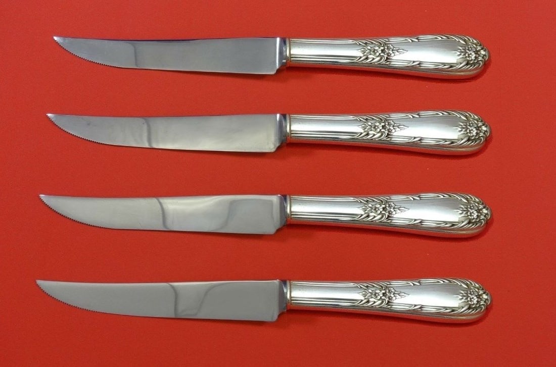 International Sterling Silver Splendor Steak Knife Set 4pc Custom Made: International Sterling Silver Splendor Steak Knife Set 4pc Custom Made Enhance your dining experience with this exquisite 4-piece steak knife set in the Splendor pattern by International. Crafted from