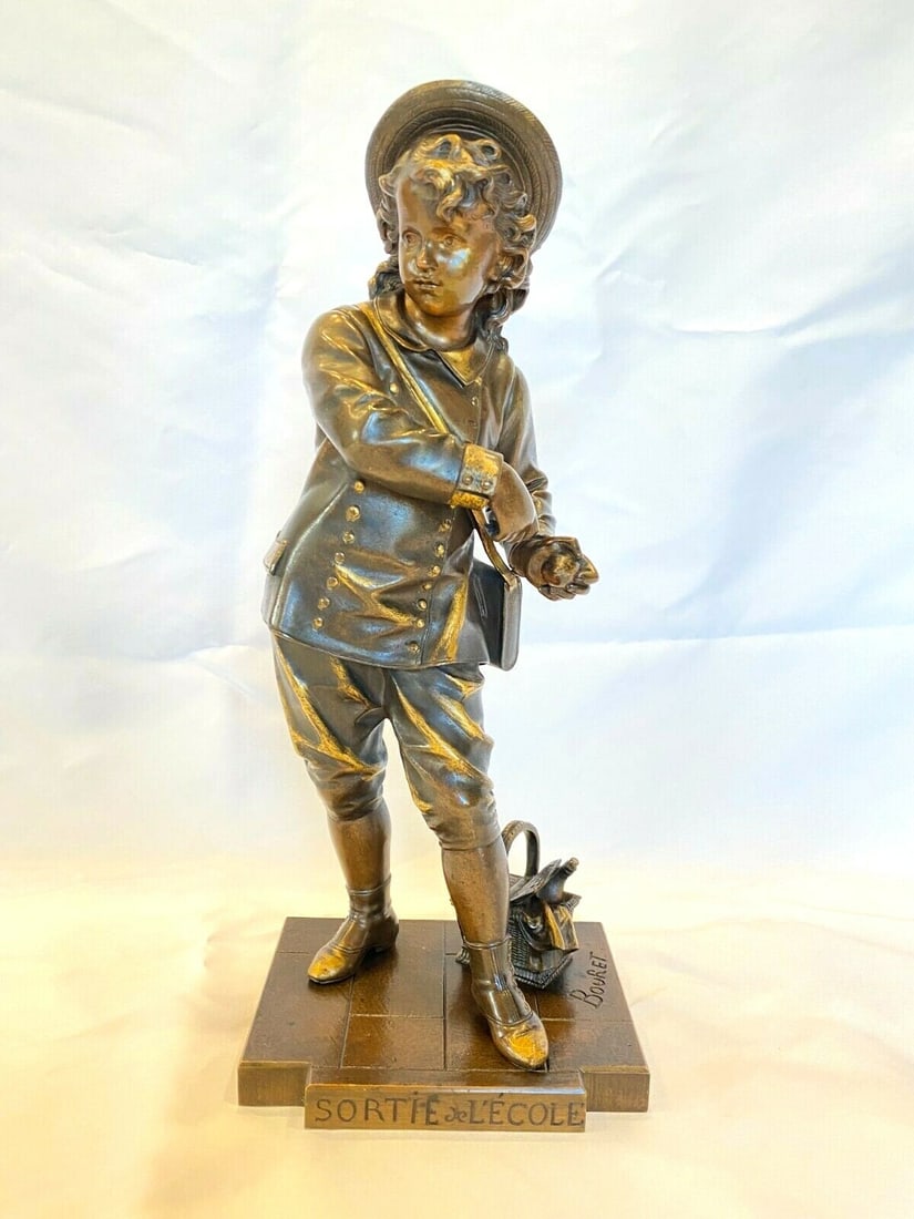 19th Century French Bronze Statue by Bouret Boy Going to School: 19th Century French Bronze Statue by Bouret Boy Going to School This exquisite 19th-century French bronze statue captures a boy on his way to school, showcasing exceptional craftsmanship. The statue, 