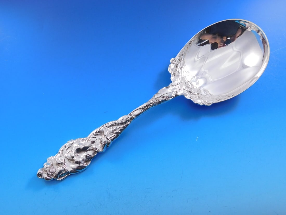 Reed and Barton Les Six Fleurs Sterling Silver Berry Spoon 9 3/4": Reed and Barton Les Six Fleurs Sterling Silver Berry Spoon 9 3/4" This exquisite berry spoon from the renowned Reed & Barton features the elegant Les Six Fleurs pattern. Crafted from high-quality ster
