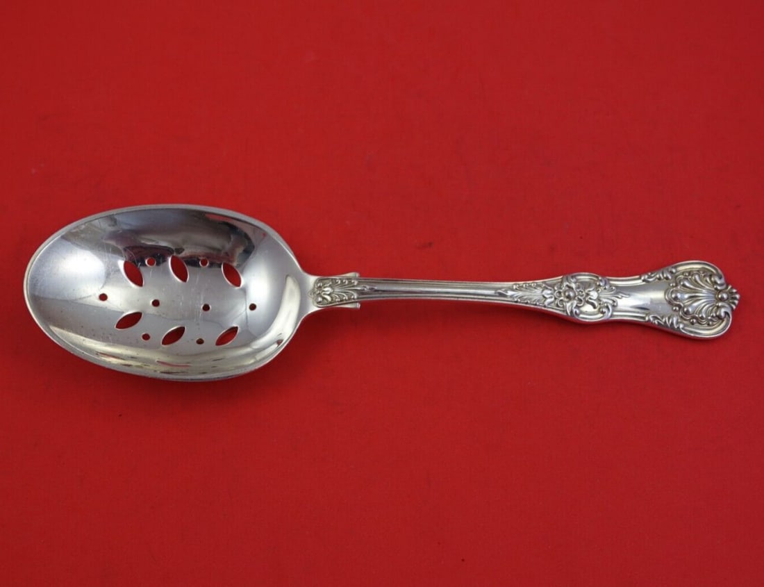 Tiffany & Co English King Sterling Silver Slotted Spoon 9": Tiffany & Co English King Sterling Silver Slotted Spoon 9" This exquisite vegetable serving spoon, crafted by Tiffany & Co. in the iconic English King pattern, showcases the timeless elegance of sterl