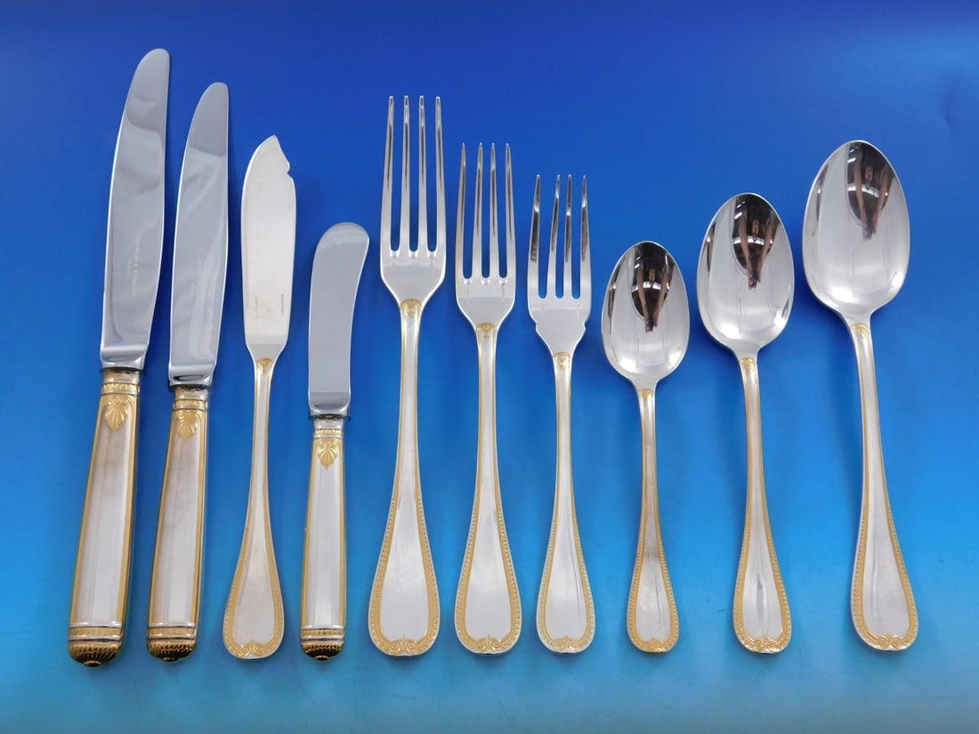 Christofle Malmaison Gold Sterling Silver 134 Piece Flatware Service: Christofle Malmaison Gold Sterling Silver 134 Piece Flatware Service This is a Christofle Malmaison Gold accent sterling silver flatware set in the Empire style, crafted in France. The set features cl