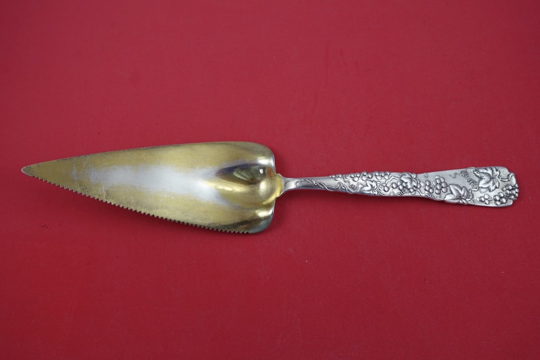 Tiffany & Co. Vine Sterling Silver Pie Server 11 3/8" Monogrammed: Tiffany & Co. Vine Sterling Silver Pie Server 11 3/8" Monogrammed Indulge in a piece of history with the Vine by Tiffany & Co. Sterling Silver Pie Server, a stunning addition to any dining collection.