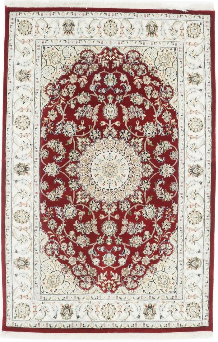 Hand-Knotted Indo-Nain Wool and Silk Area Rug 4'1 x 6'2 Floral Design: Hand-Knotted Indo-Nain Wool and Silk Area Rug 4'1 x 6'2 Floral Design This handmade Indo-Nain area rug features a classic floral pattern crafted from wool and silk, offering both durability and elegan