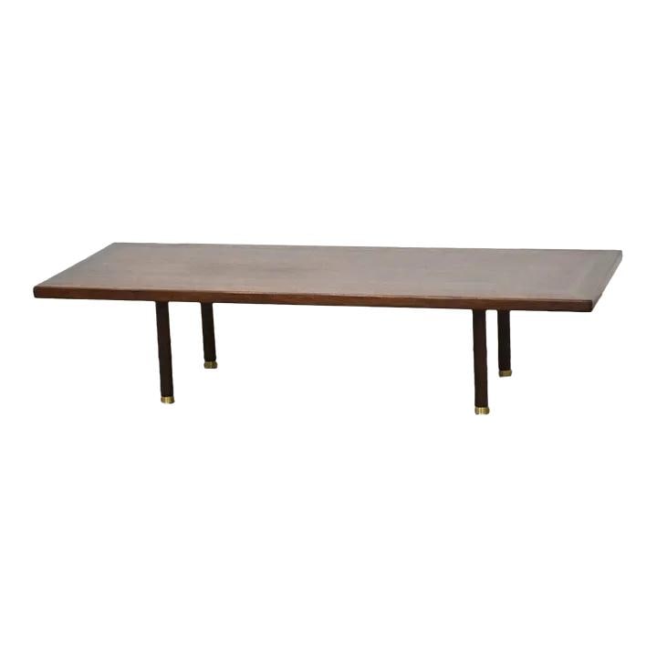 Mid-Century Modern Mahogany Coffee Table with Brass Feet 60": Mid-Century Modern Mahogany Coffee Table with Brass Feet 60" This stunning mid-century modern coffee table is crafted from rich mahogany and features elegant brass-capped feet. Professionally refinish