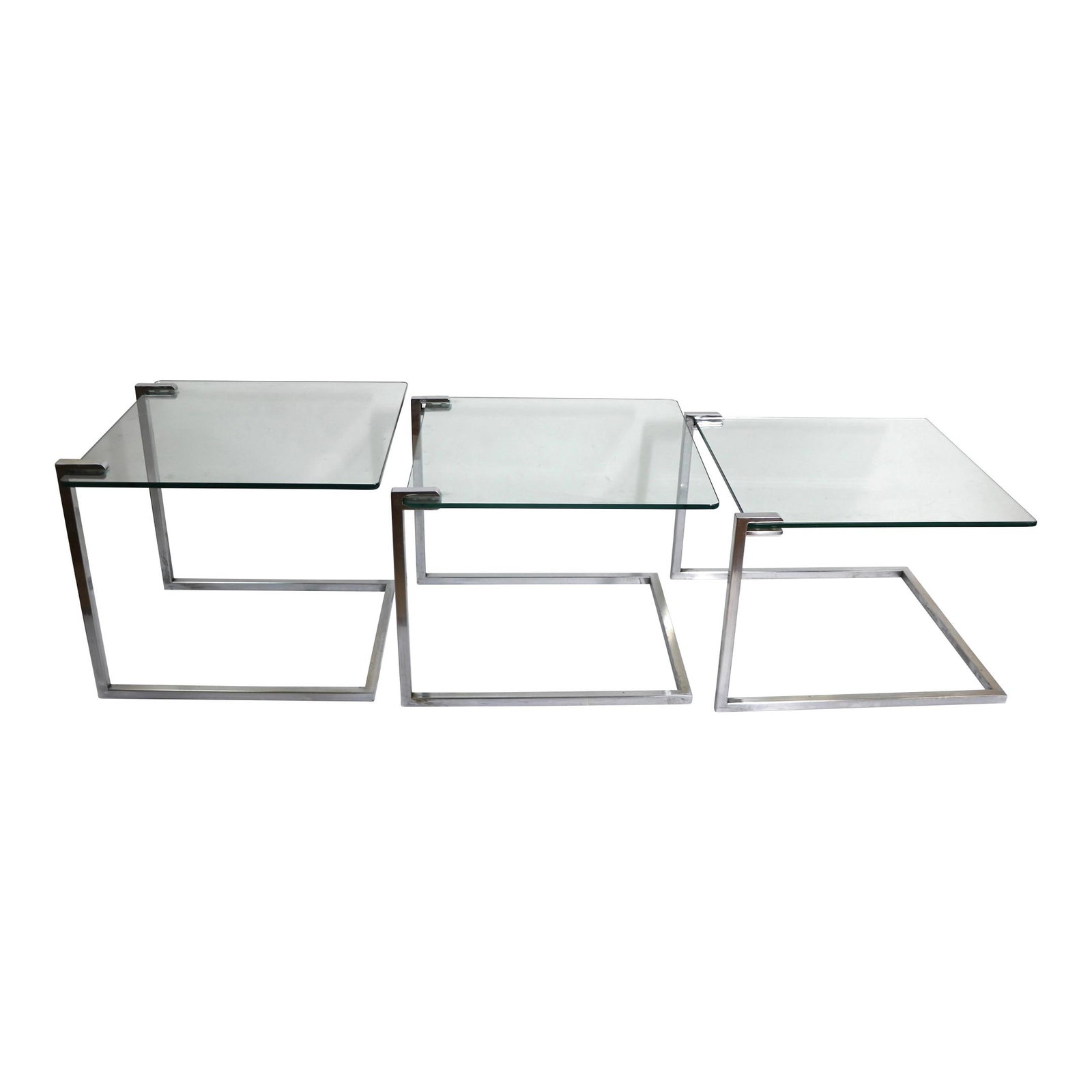 Stylish Chrome and Glass Nesting Tables Set of 3 After Baughman: Stylish Chrome and Glass Nesting Tables Set of 3 After Baughman This chic and stylish set of three post-modern nesting tables showcases a striking Art Deco revival design. Each table features a cantil