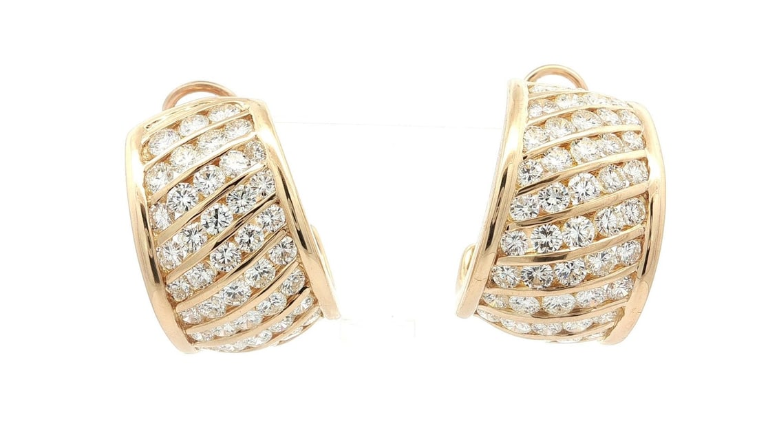 18k Yellow Gold 9.5ctw Diamond Channel Set Cuff Earrings: 18k Yellow Gold 9.5ctw Diamond Channel Set Cuff Earrings Make a bold statement with these stunning 18k Yellow Gold Wide Cuff Earrings, featuring a dazzling arrangement of 120 round brilliant cut natur