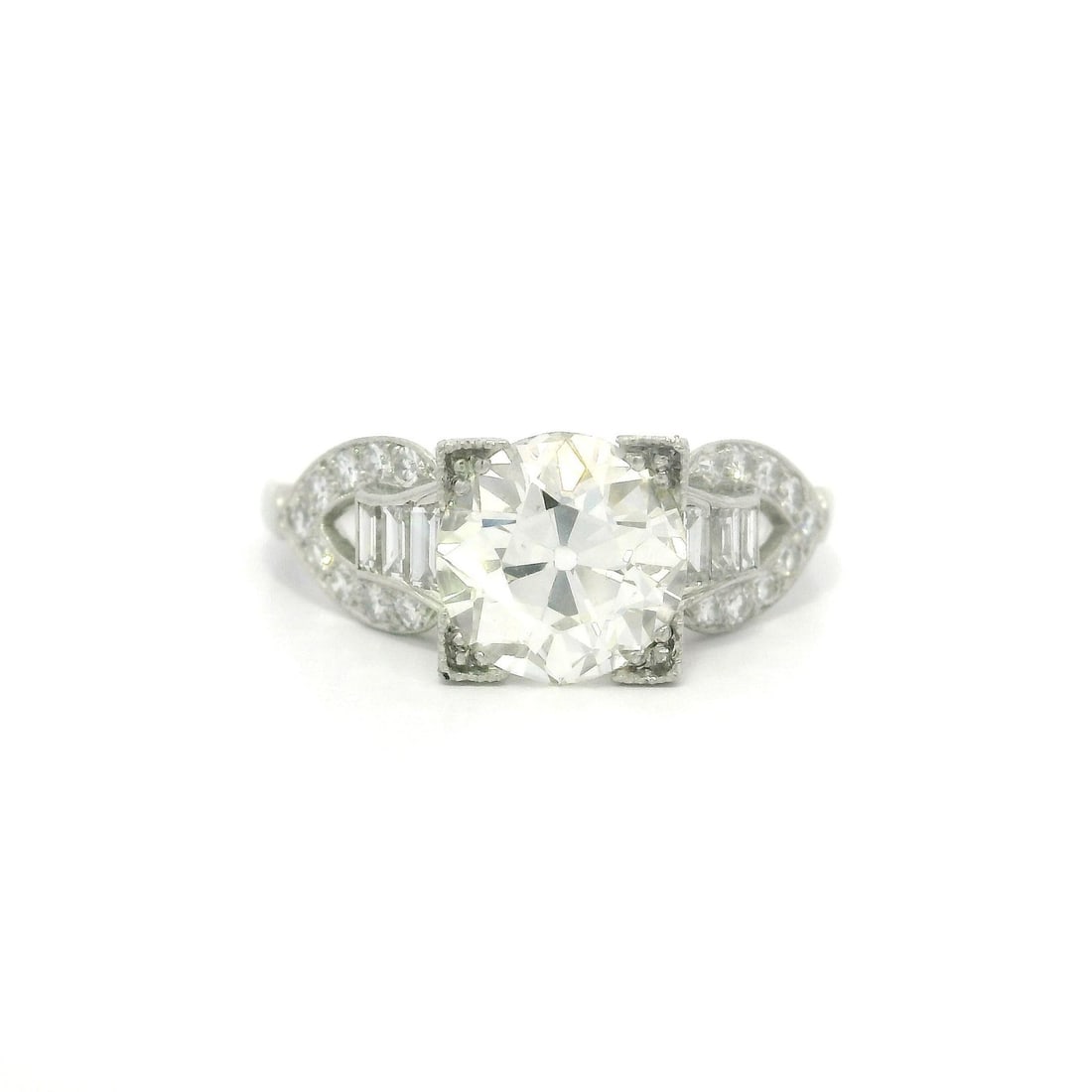 Antique Edwardian Platinum Engagement Ring GIA 2.09ct Old Diamond Buckle Sides: Antique Edwardian Platinum Engagement Ring GIA 2.09ct Old Diamond Buckle Sides This exquisite Antique Edwardian Engagement Ring features a stunning old European cut diamond at its center, weighing 1.7
