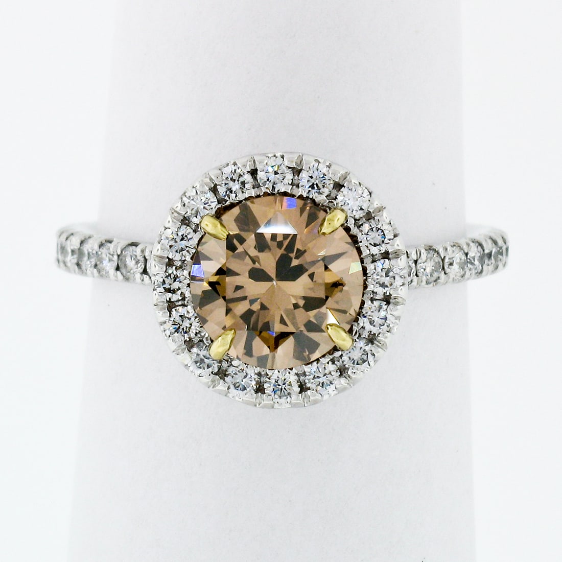 GIA certified 18k white gold halo ring with fancy dark orange brown diamond: GIA certified 18k white gold halo ring with fancy dark orange brown diamond This elegant engagement ring features a 1.06 carat GIA-certified natural fancy dark orange-brown round brilliant diamond as 
