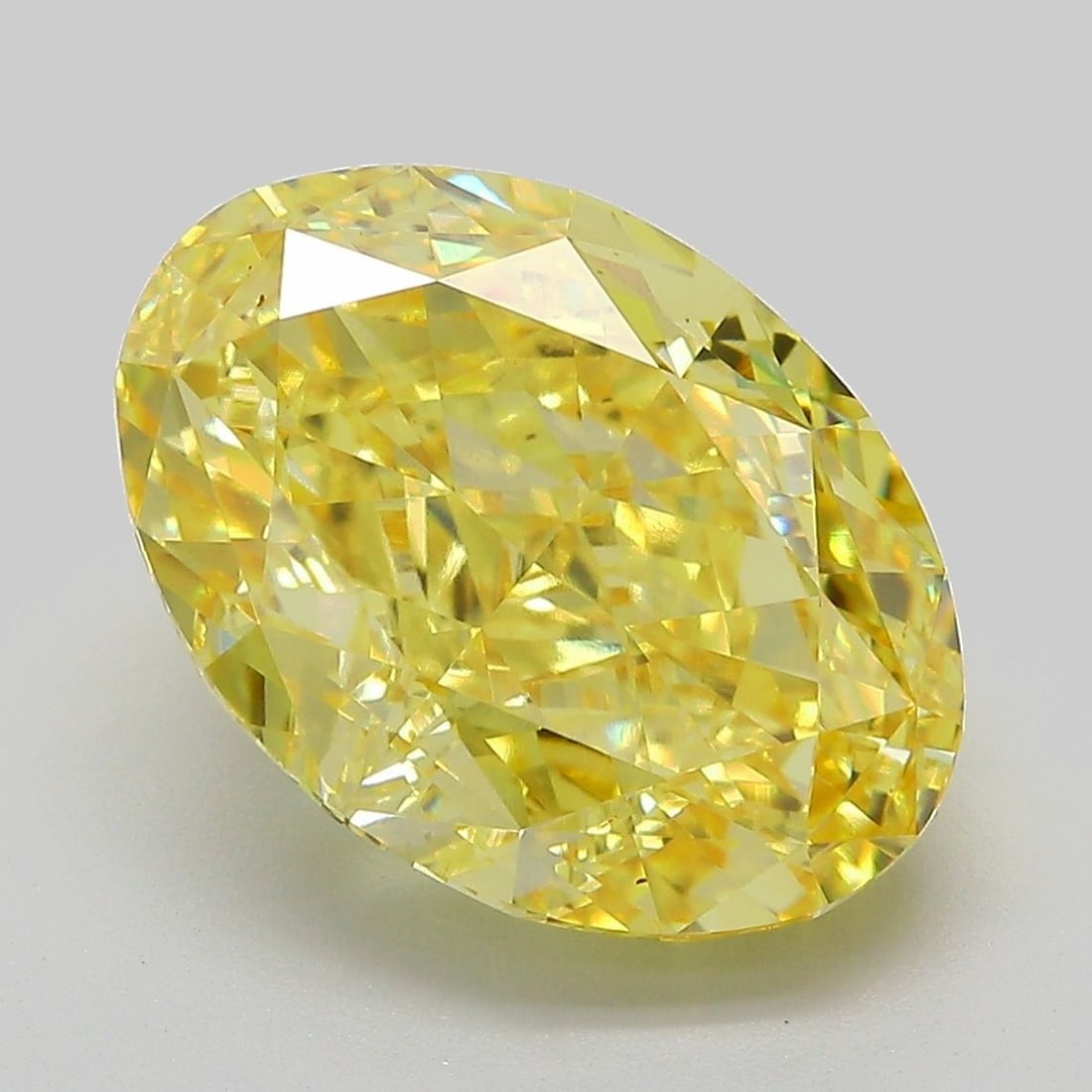 Loose Diamond - OVAL 7.17ct Fancy Vivid Yellow VVS2: Loose Diamond - OVAL 7.17ct Fancy Vivid Yellow VVS2 Source: This is a real non-mined Diamond that has been grown in a lab Shape: OVAL Carats: 7.17 Color: Fancy Vivid Yellow Certification: IGI Video:
