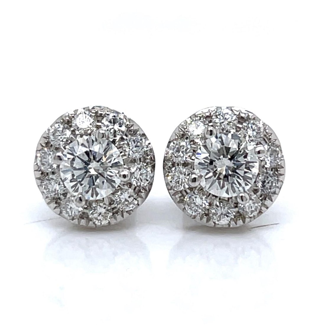 Diamond Stud Earrings in 18K White Gold with 2.20 Carats: Diamond Stud Earrings in 18K White Gold with 2.20 Carats These pre-owned stud earrings feature 18K white gold settings adorned with two diamonds approximately 1.20 carats total, displaying E-F color a