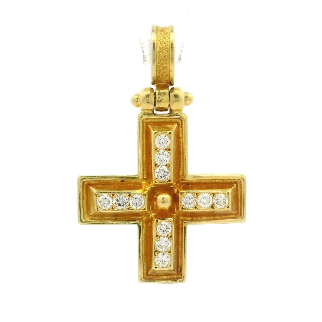 0.60 Carat Diamond Cross Pendant in Solid 18k Yellow Gold Vintage: 0.60 Carat Diamond Cross Pendant in Solid 18k Yellow Gold Vintage This vintage cross pendant is crafted from solid 18k yellow gold and features twelve natural round brilliant cut diamonds with a total