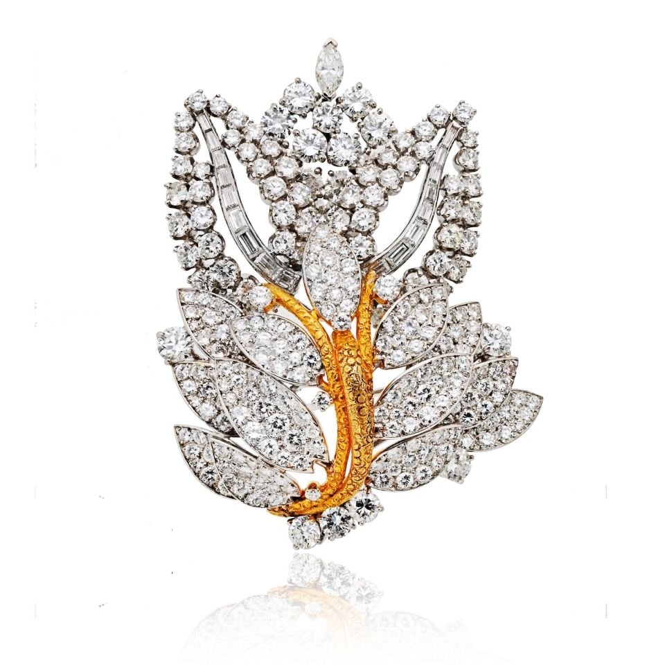 1960s Platinum 18K Gold 16.5ct Diamond Leaf Brooch: 1960s Platinum 18K Gold 16.5ct Diamond Leaf Brooch This exquisite estate brooch, crafted circa 1960s, beautifully captures the elegance of vintage design. Made in a luxurious combination of 18K yellow