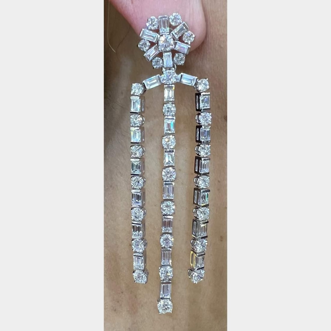Platinum 21.57 Ct Diamond Chandelier Earrings 3.5 Inches: Platinum 21.57 Ct Diamond Chandelier Earrings 3.5 Inches Elevate your elegance with these stunning Platinum Diamond Chandelier Earrings, featuring a remarkable total diamond weight of 21.57 Ct. Crafte