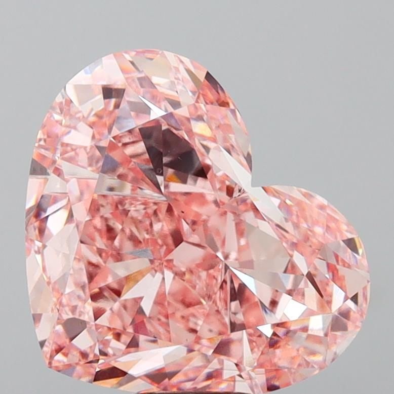 Loose Diamond - HEART 11.82ct Fancy Vivid Pink VS2: Loose Diamond - HEART 11.82ct Fancy Vivid Pink VS2 Source: This is a real non-mined Diamond that has been grown in a lab Shape: HEART Carats: 11.82 Color: Fancy Vivid Pink Certification: IGI Video: