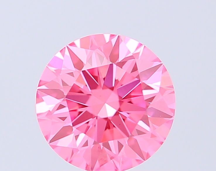 Ideal Loose Diamond - ROUND 0.72ct Fancy Vivid Pink VVS2: Ideal Loose Diamond - ROUND 0.72ct Fancy Vivid Pink VVS2 Source: This is a real non-mined Diamond that has been grown in a lab Shape: ROUND Carats: 0.72 Color: Fancy Vivid Pink Certification: IGI Vide