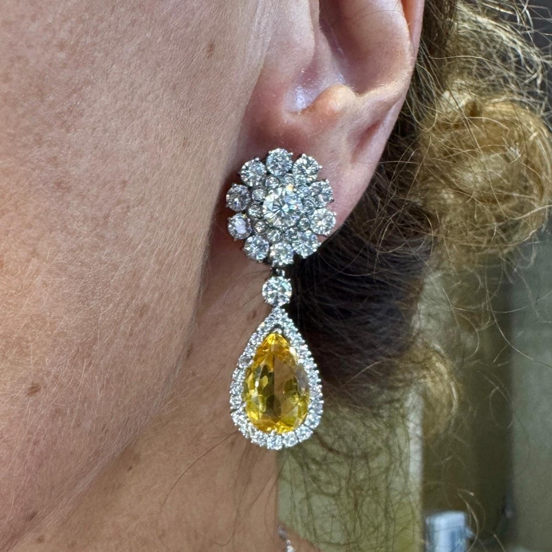 Platinum Earrings with Citrine and Diamond Accents Circa 1950s: Platinum Earrings with Citrine and Diamond Accents Circa 1950s These 1950s platinum earrings feature two citrines with an approximate total weight of 20.00 carats, accented by two diamonds totaling ap