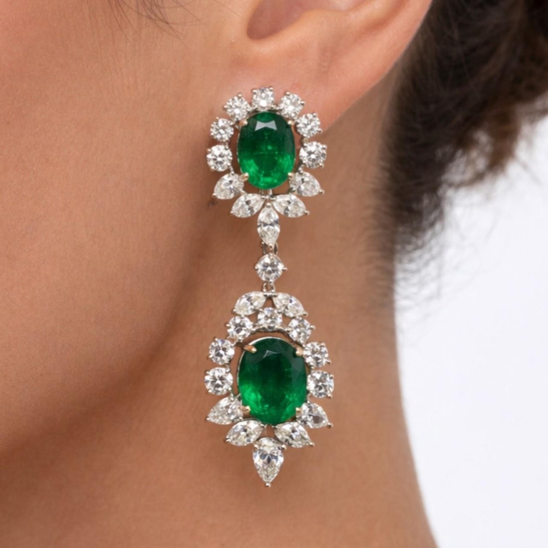 Emerald and Diamond Drop Earrings in Platinum and 18K White Gold 2.5 Inch: Emerald and Diamond Drop Earrings in Platinum and 18K White Gold 2.5 Inch These earrings are crafted from platinum and 18K white gold, showcasing 4 emeralds with a total weight of 20.00 carats. They a