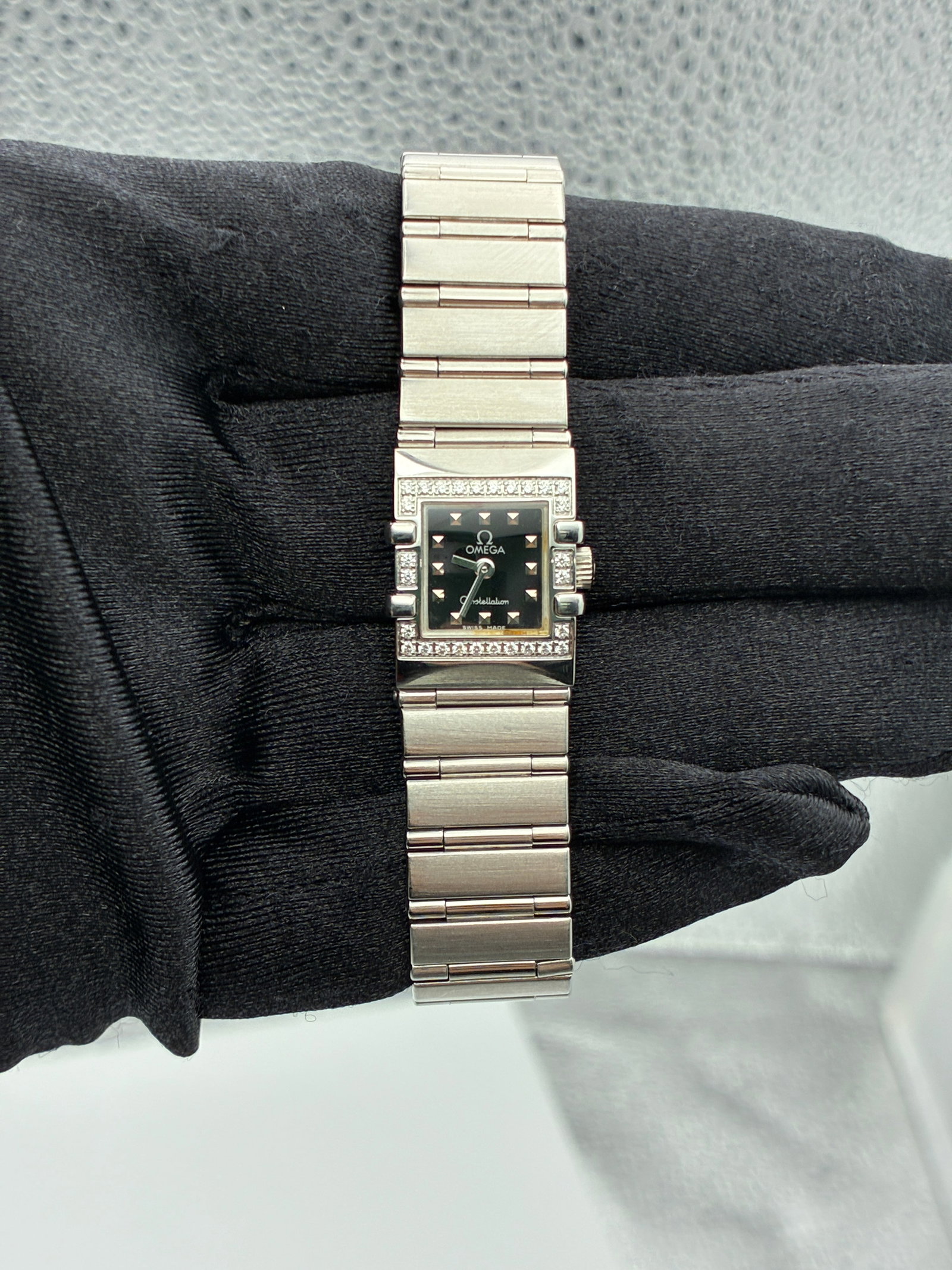 Ladies Omega Constellation Diamond Bezel Steel Bracelet Ref 1537.51.00: Ladies Omega Constellation Diamond Bezel Steel Bracelet Ref 1537.51.00 This Omega Constellation ladies' watch features a striking black dial set within a stainless steel case, complemented by a