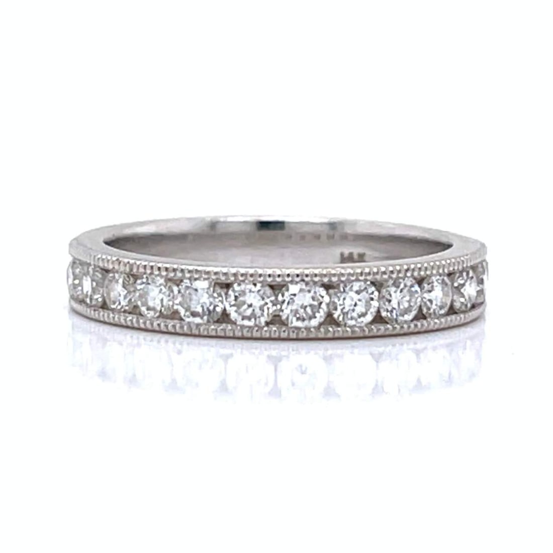 Elegant 14K White Gold 0.75 Ct Diamond Anniversary Band: Elegant 14K White Gold 0.75 Ct Diamond Anniversary Band This stunning 14K white gold anniversary band features a total of 0.75 carats of sparkling diamonds. The ring is set with 13 diamonds, showcasin