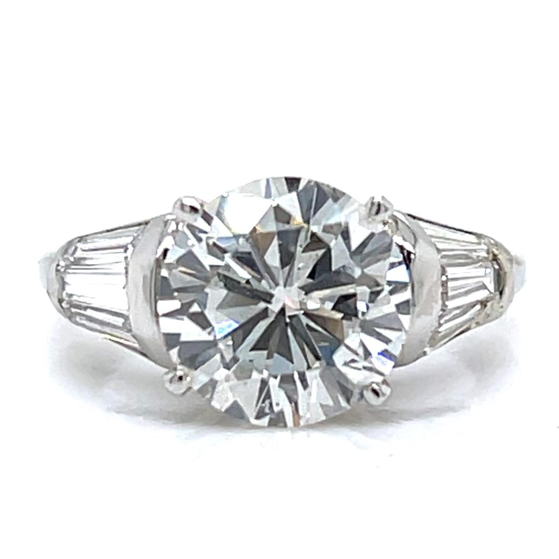 GIA Certified 3.00 Carat Diamond Platinum Engagement Ring With Baguette Accents: GIA Certified 3.00 Carat Diamond Platinum Engagement Ring With Baguette Accents This platinum engagement ring features a GIA certified 3.00 carat diamond with G color and SI1 clarity, measuring 9.16 -