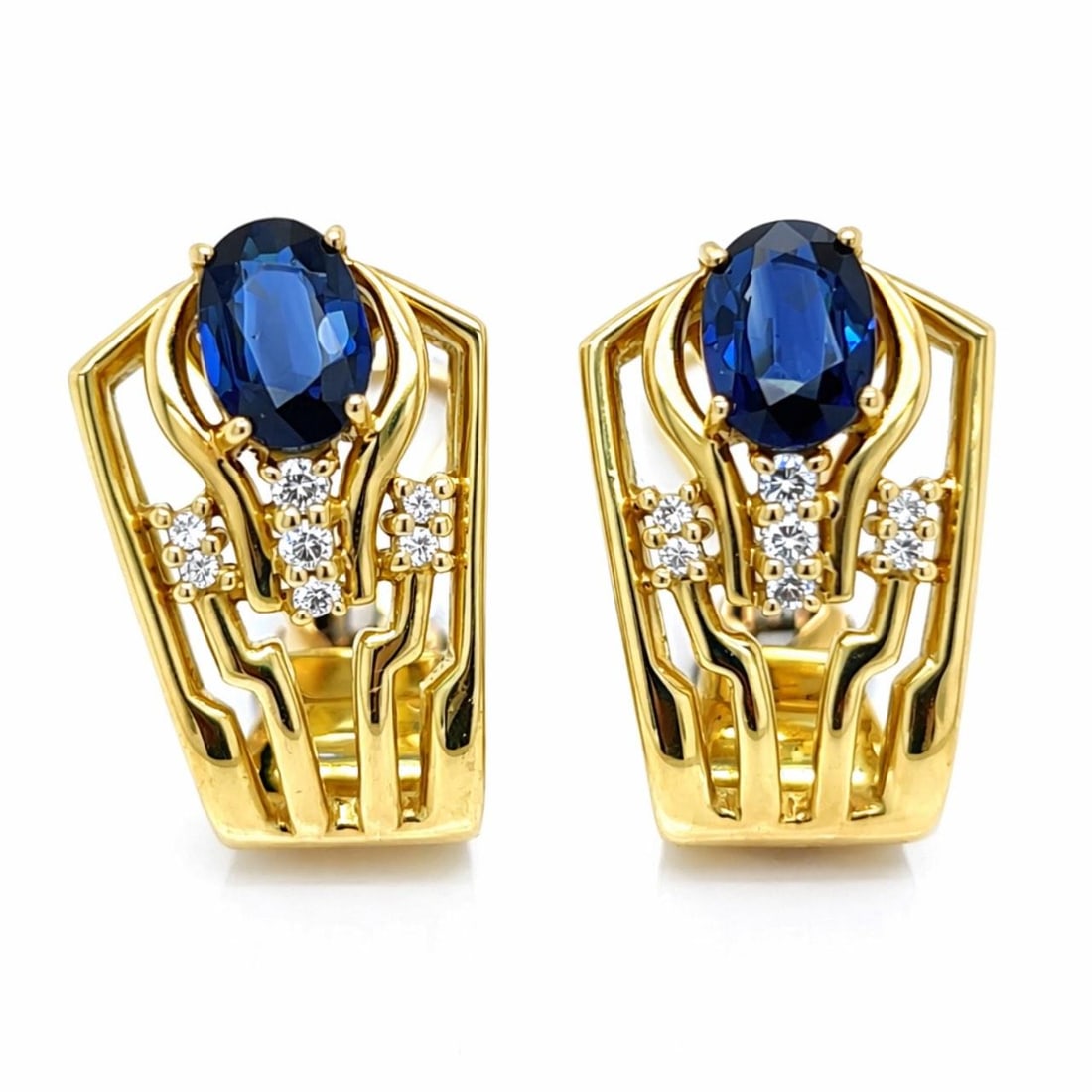 Sapphire and Diamond Drop Earrings in 18K Yellow Gold 1 Inch: Sapphire and Diamond Drop Earrings in 18K Yellow Gold 1 Inch These pre-owned earrings are crafted from 18K yellow gold and feature two sapphires with a combined approximate weight of 2.00 carats. Acce