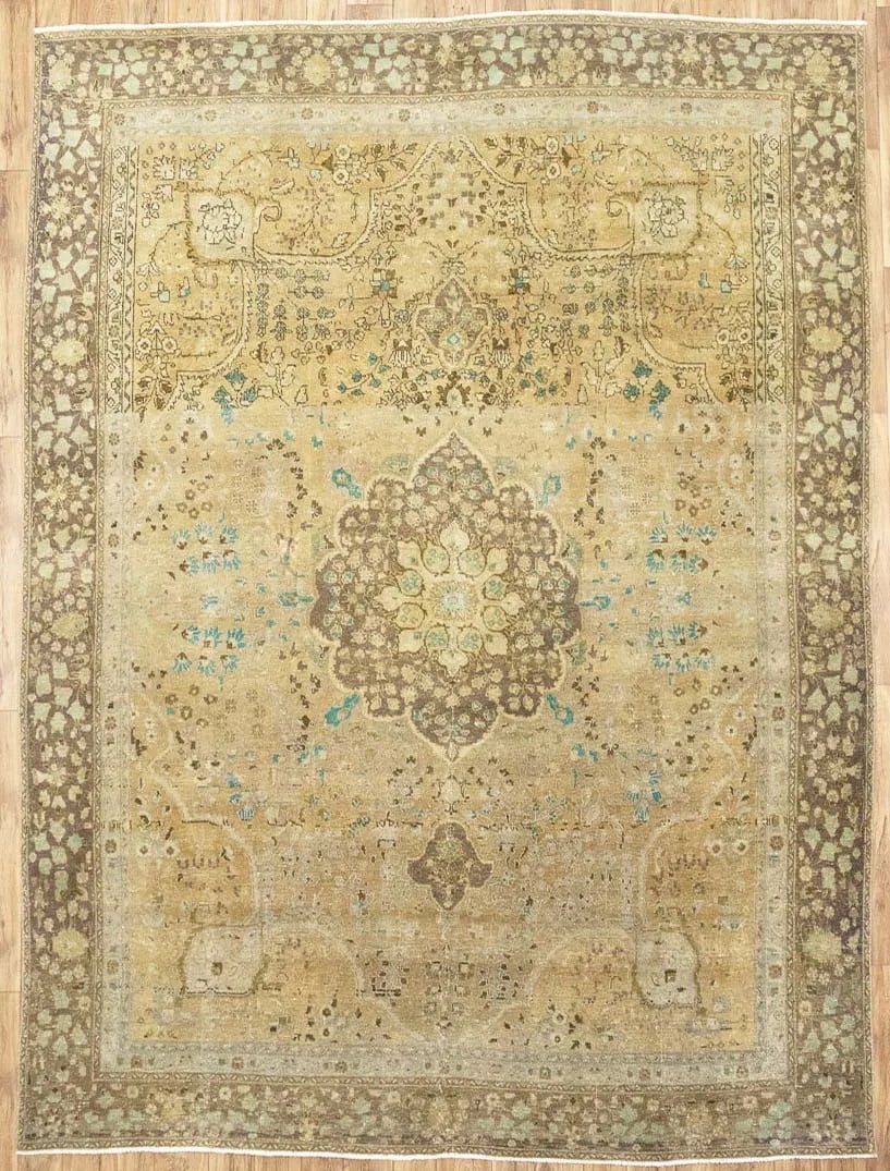 Vintage Floral Wool Hand-Knotted Area Rug 9'4 x 12'5: Vintage Floral Wool Hand-Knotted Area Rug 9'4 x 12'5 This large semi-antique Oriental rug features a hand-knotted construction and a classic floral pattern in muted tones of golden beige, brown, cream