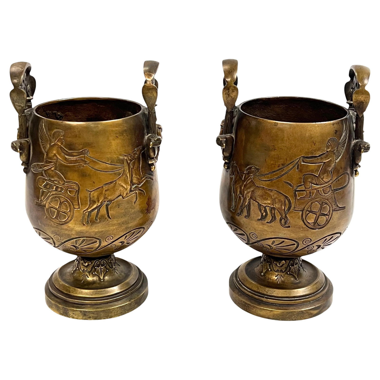 Set of Two Bronze Egyptian Revival Vases with Chariot Motifs c1880: Set of Two Bronze Egyptian Revival Vases with Chariot Motifs c1880 This pair of late 19th century Egyptian Revival bronze vases features intricate designs, including chariots pulled by leopards on one