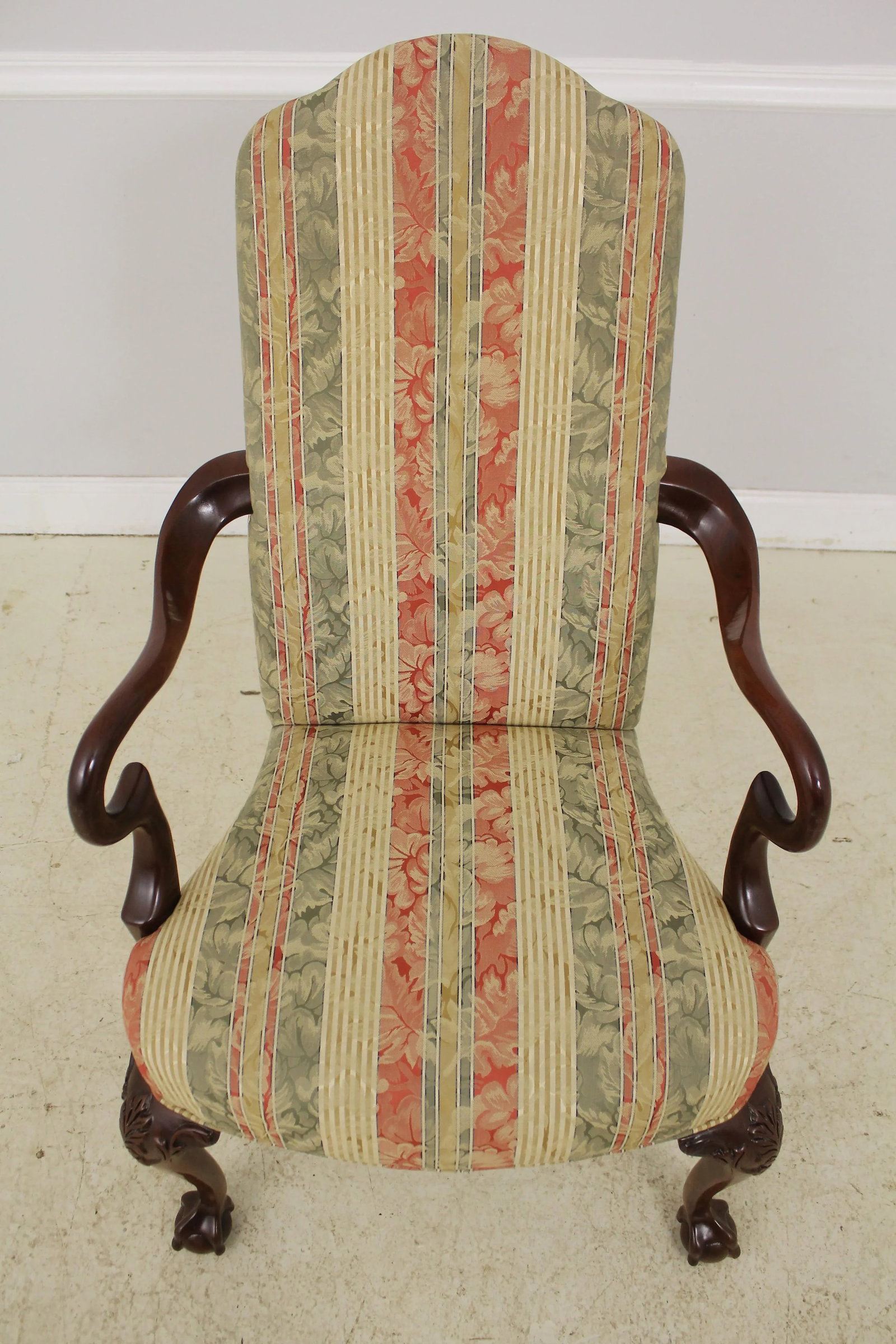Southwood Mahogany Armchair with Ball & Claw Feet and Damask Upholstery: Southwood Mahogany Armchair with Ball & Claw Feet and Damask Upholstery This exquisite Southwood Ball & Claw Mahogany Armchair is a stunning addition to any traditional decor. Crafted from solid mahog