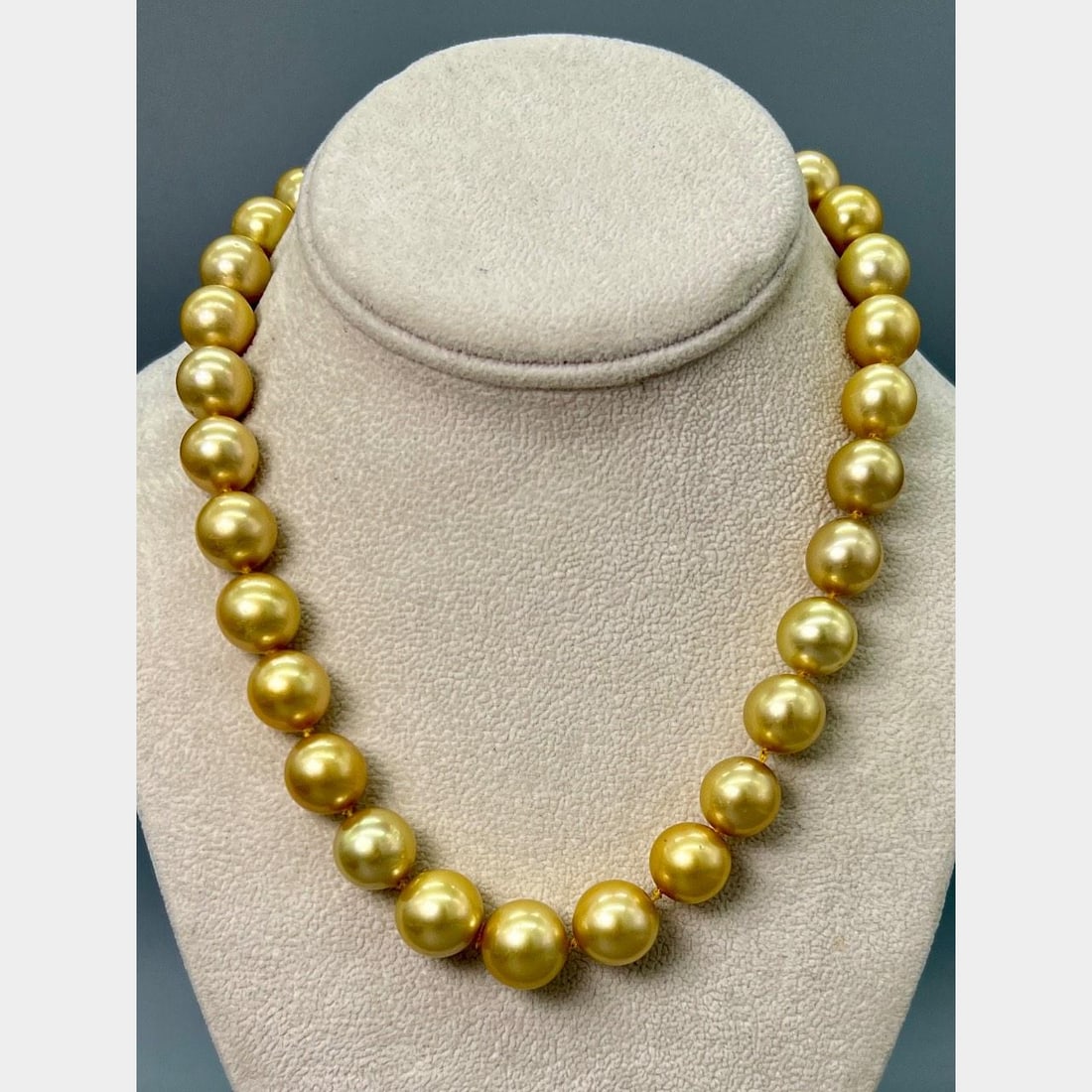 Yellow South Sea Pearl Strand with 14K Gold Diamond Clasp 17 Inch: Yellow South Sea Pearl Strand with 14K Gold Diamond Clasp 17 Inch This necklace features 31 graduated yellow South Sea pearls, ranging in size from 14.4 mm to 11.95 mm. It is secured with a 14K yellow