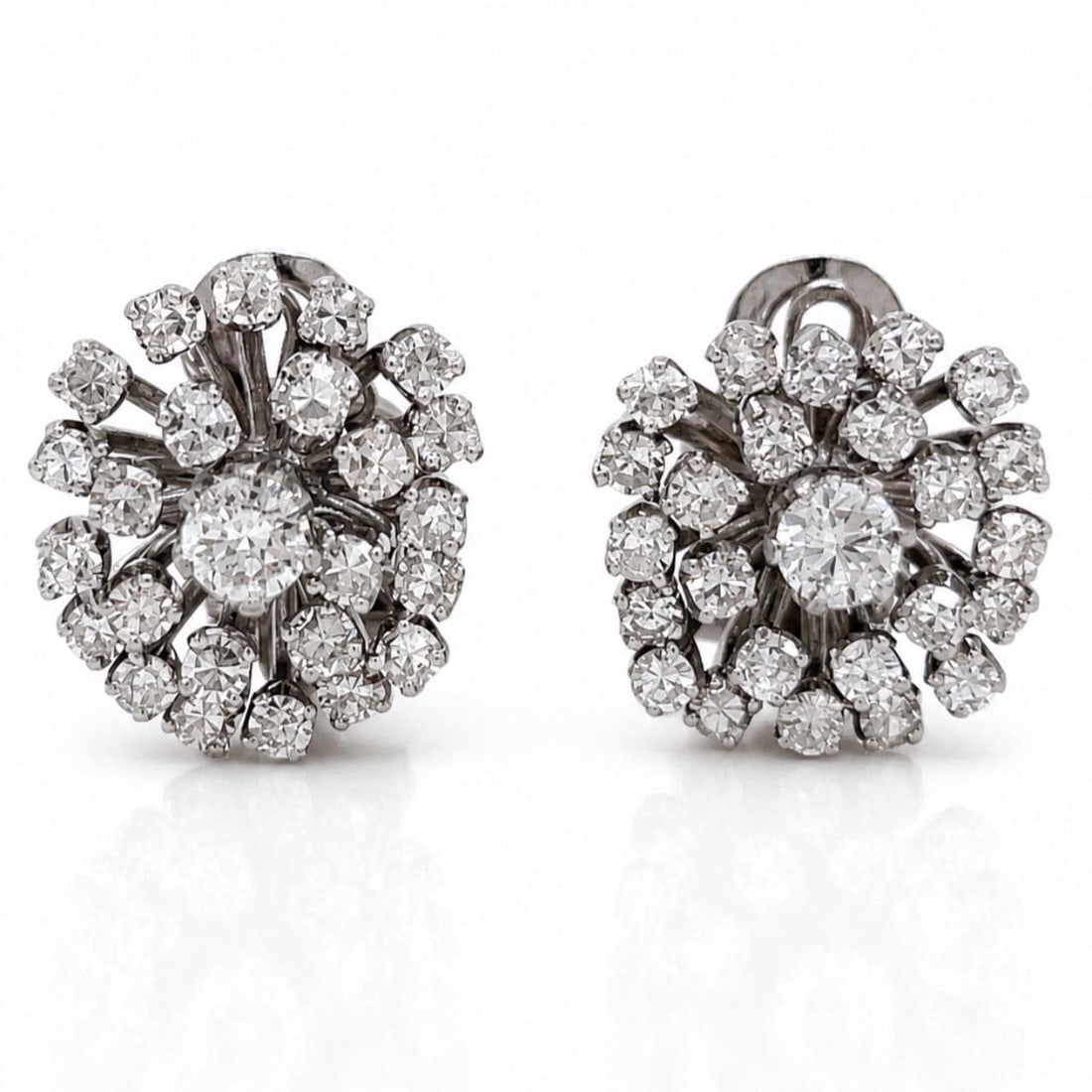 Vintage Platinum Diamond Earrings 2.75 Ct 52 Stones: Vintage Platinum Diamond Earrings 2.75 Ct 52 Stones These elegant 1960s diamond earrings are crafted from platinum and feature a total of approximately 2.75 carats of diamonds. The earrings are set wi
