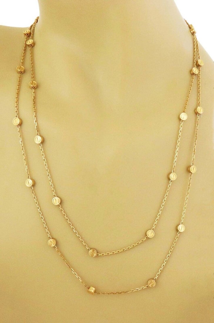 Cartier Love station necklace 18k yellow gold with certificate: Cartier Love station necklace 18k yellow gold with certificate This Cartier Love Station long necklace is crafted in solid 18k yellow gold and features the iconic Love motif stations arranged along an