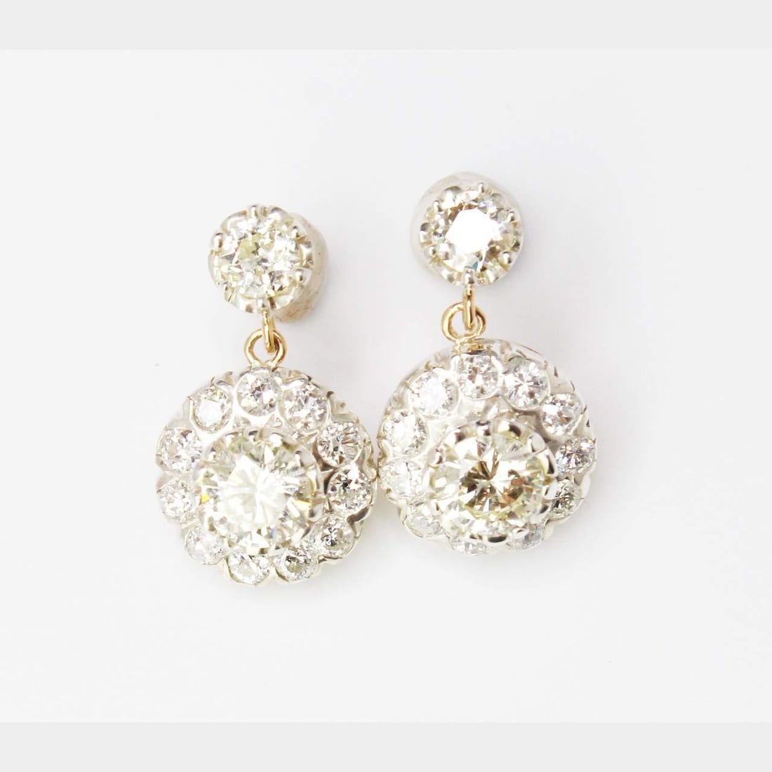 Diamond Earrings 5.90 Ct European Cut in 18K Yellow Gold and Silver: Diamond Earrings 5.90 Ct European Cut in 18K Yellow Gold and Silver These earrings feature a combination of 18K yellow gold and silver tops, set with a total of approximately 5.90 carats of diamonds. 