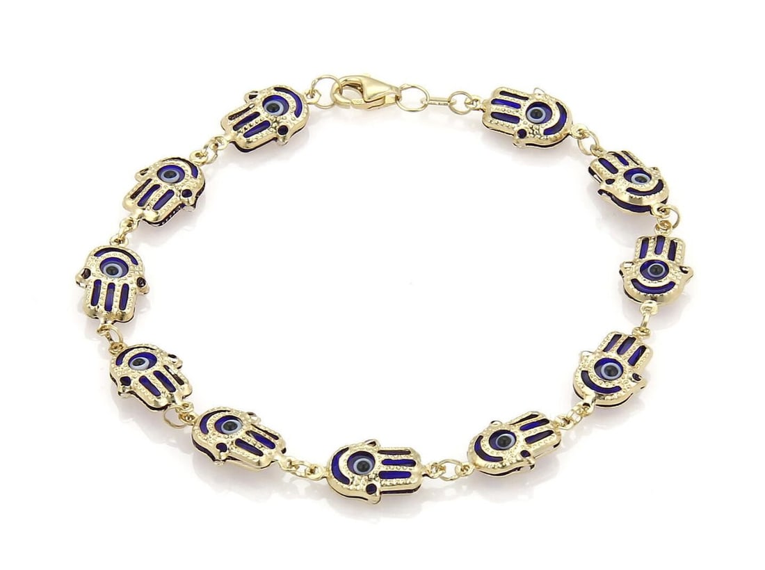 Vintage 14k Yellow Gold Evil Eye Hamsa Charm Bracelet: Vintage 14k Yellow Gold Evil Eye Hamsa Charm Bracelet This vintage charm bracelet is crafted from 14k yellow gold and features alternating navy blue evil eye motifs and protective hamsa hand links. Th