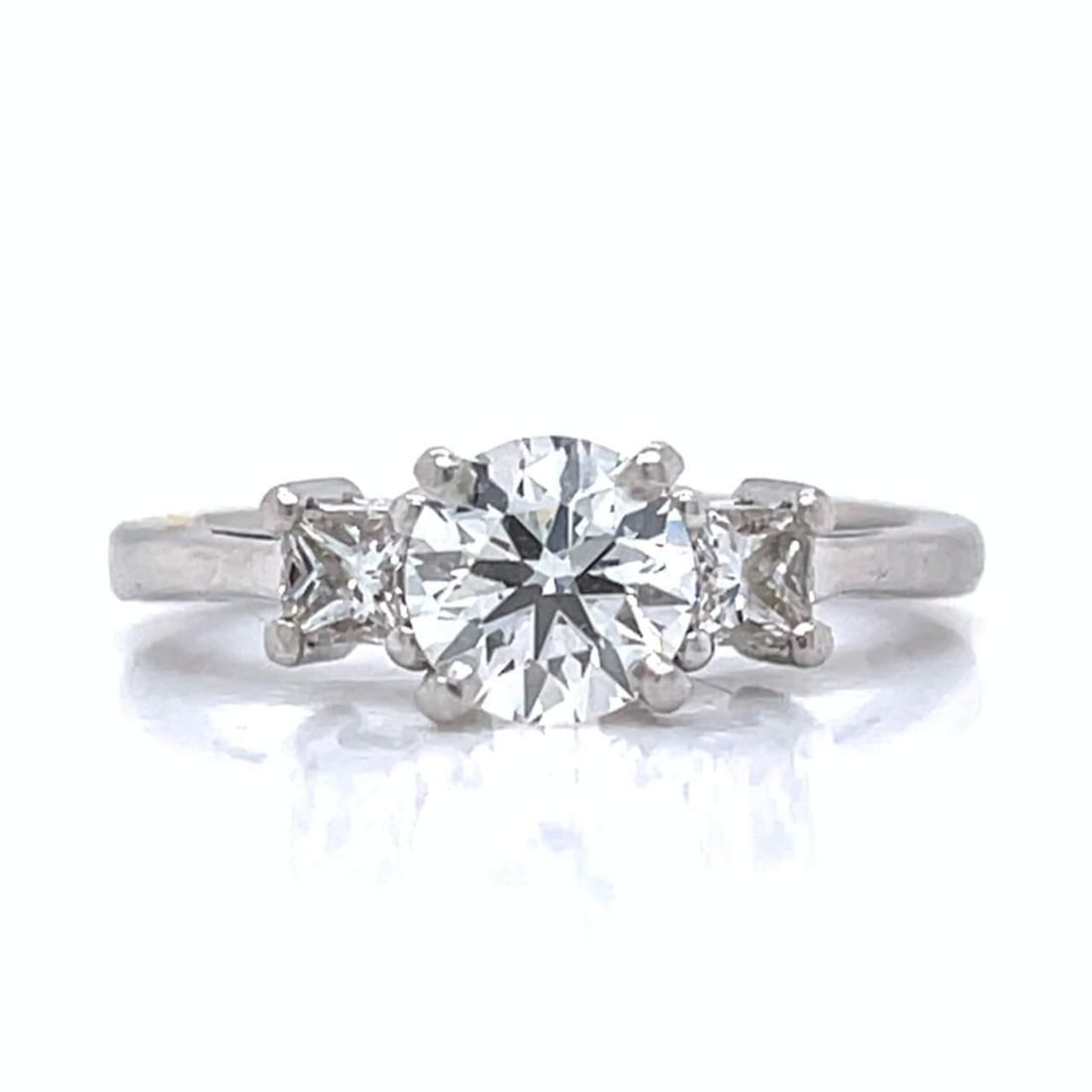 Platinum Diamond Ring 0.90 Ct Center H VVS1 with 0.30 Ct Side Diamonds: Platinum Diamond Ring 0.90 Ct Center H VVS1 with 0.30 Ct Side Diamonds This exquisite platinum ring features a stunning 0.90 Ct diamond at its center, exhibiting H color and VVS1 clarity, ensuring a b