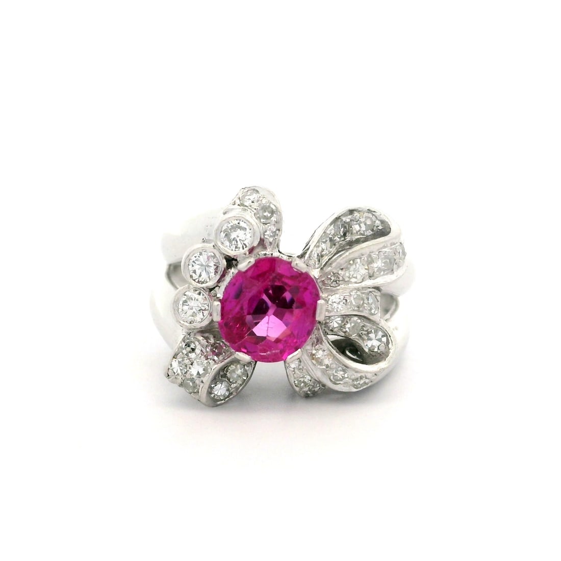 Vintage Platinum GIA Certified 1.90ct Burma Pink Sapphire Diamond Bow Ring: Vintage Platinum GIA Certified 1.90ct Burma Pink Sapphire Diamond Bow Ring This exquisite vintage cocktail ring features a stunning natural genuine pink sapphire at its center, measuring