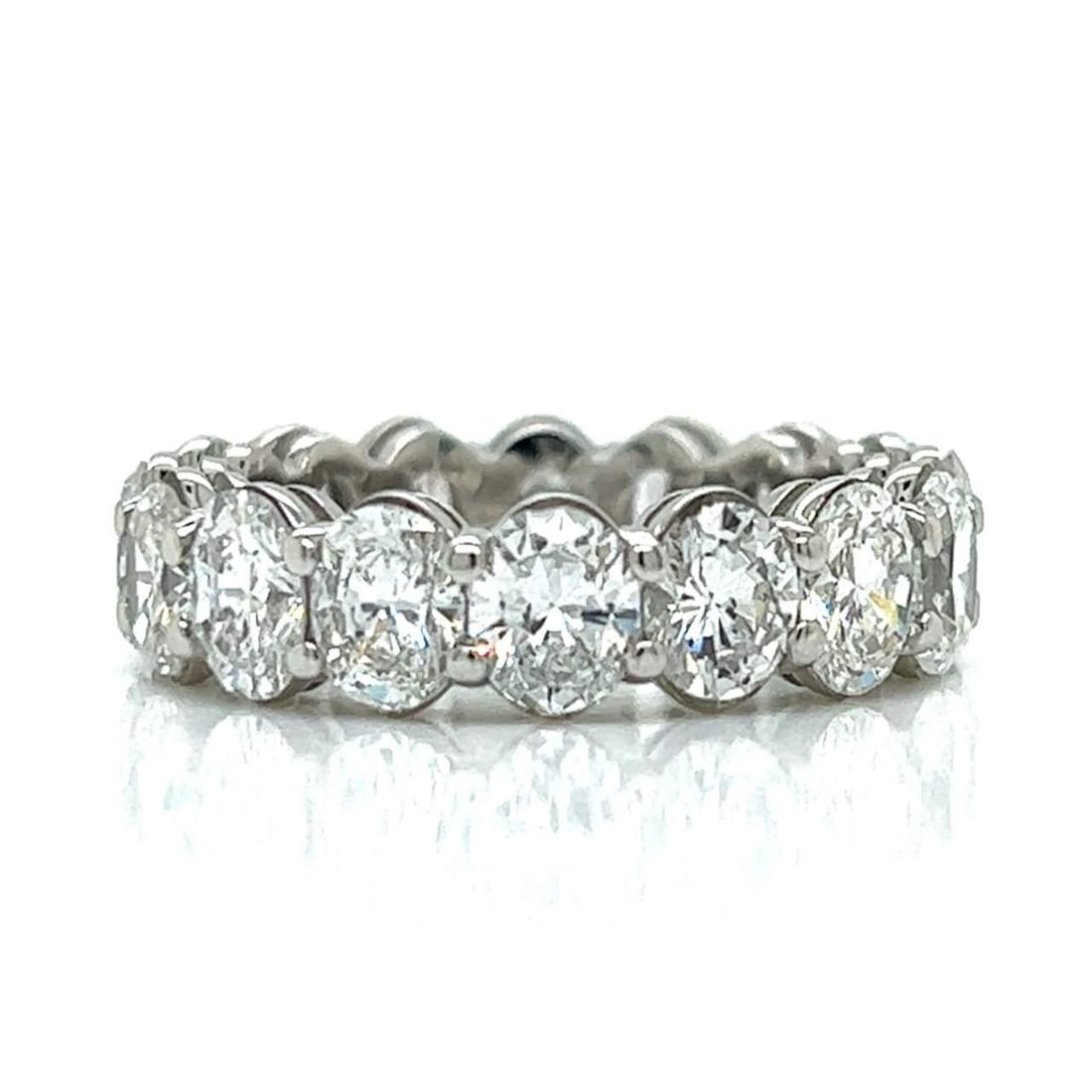 Platinum Eternity Band with 15 Oval Diamonds 6.90 Ct F-G VVS-VS: Platinum Eternity Band with 15 Oval Diamonds 6.90 Ct F-G VVS-VS This exquisite Platinum Eternity Band showcases a stunning collection of 15 oval diamonds, with a total weight of approximately 6.90 Ct.