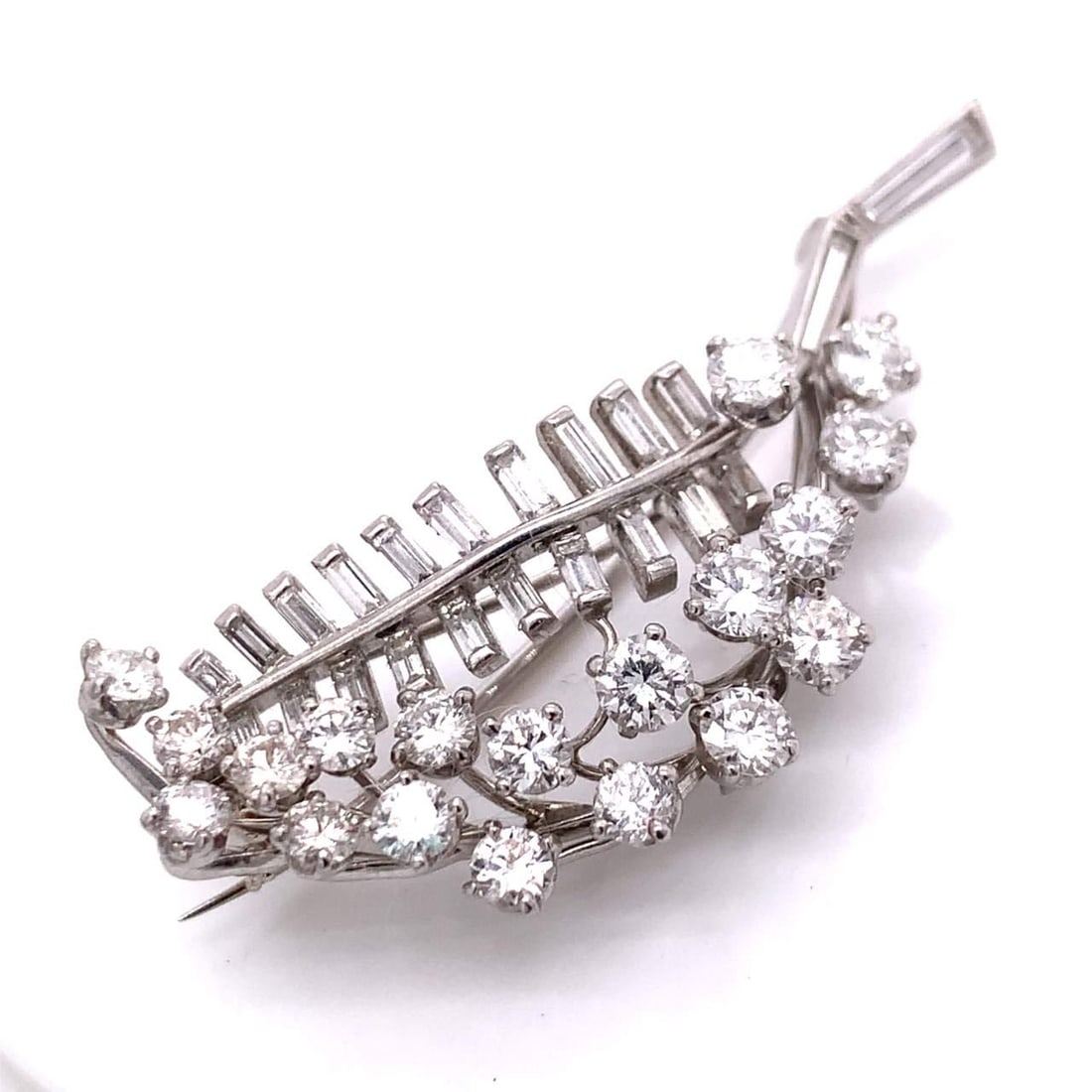 Platinum Diamond Branch Brooch 22 Baguette 18 Round Diamonds 2 Inches: Platinum Diamond Branch Brooch 22 Baguette 18 Round Diamonds 2 Inches This exquisite Platinum Diamond Branch Brooch features a stunning array of 22 baguette diamonds, approximately 1.50 carats, and 18