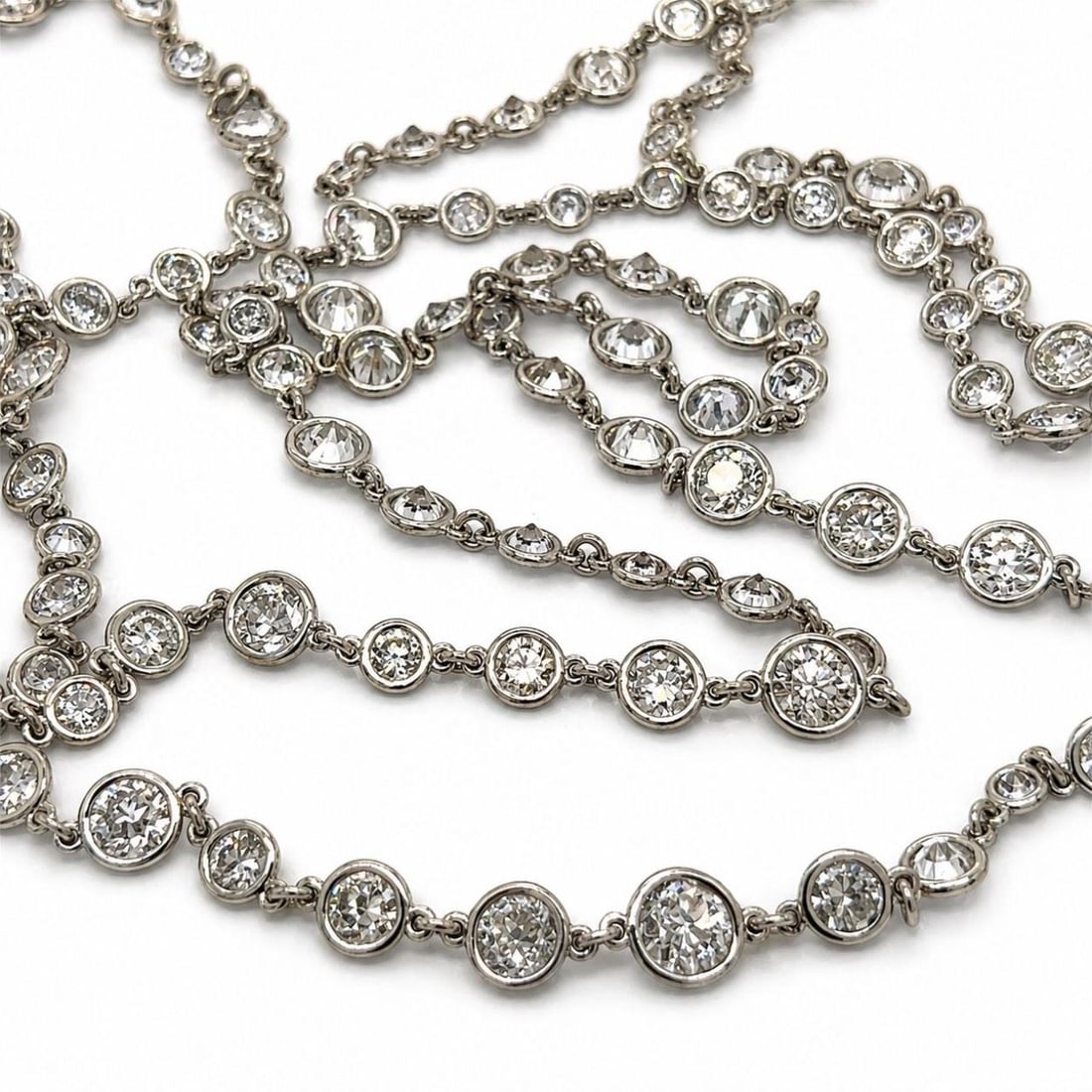 Platinum Diamond By The Yard Necklace 22.20 Ct 49 Inch: Platinum Diamond By The Yard Necklace 22.20 Ct 49 Inch This elegant necklace features 173 European-cut diamonds with a total weight of approximately 22.20 carats, set in platinum. The diamonds display