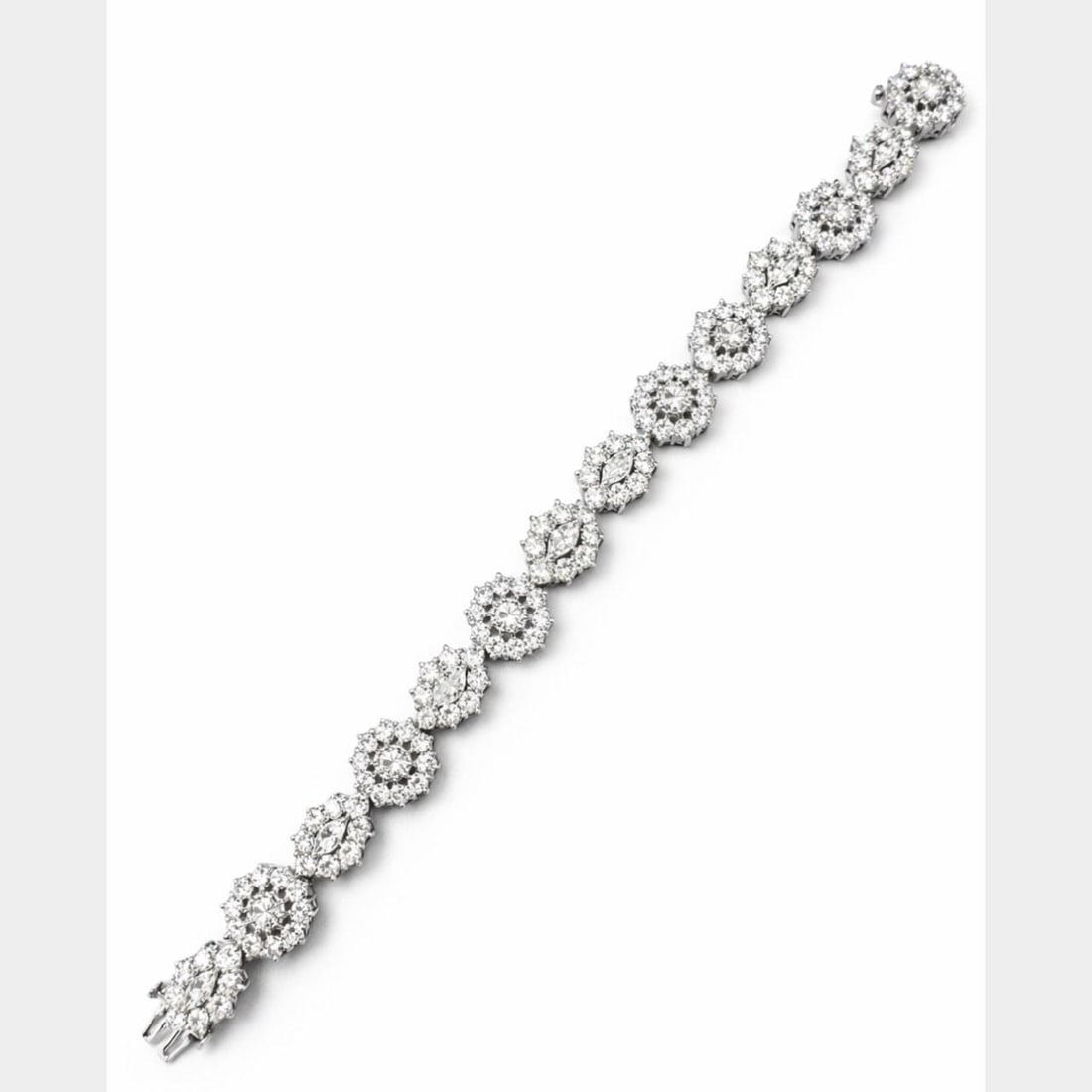6.5 Inch Platinum Bracelet with 14.75 Carat Diamonds: 6.5 Inch Platinum Bracelet with 14.75 Carat Diamonds This platinum bracelet features a total diamond weight of approximately 14.75 carats. It is set with 14 diamonds totaling about 3.50 carats, along 