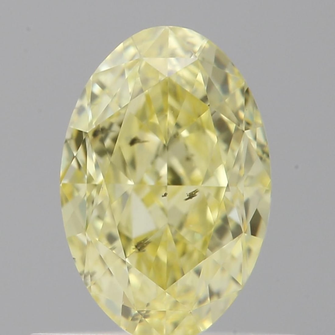 Loose Diamond - OVAL 0.7ct Fancy Yellow SI2: Loose Diamond - OVAL 0.7ct Fancy Yellow SI2 Source: Natural Shape: OVAL Carats: 0.7 Color: Fancy Yellow Certification: GIA Video: