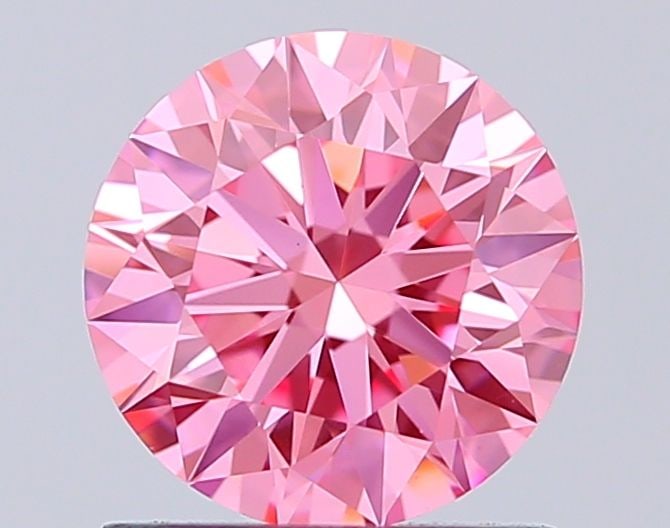 Ideal Loose Diamond - ROUND 1.05ct Fancy Vivid Pink VS1: Ideal Loose Diamond - ROUND 1.05ct Fancy Vivid Pink VS1 Source: This is a real non-mined Diamond that has been grown in a lab Shape: ROUND Carats: 1.05 Color: Fancy Vivid Pink Certification: IGI Video