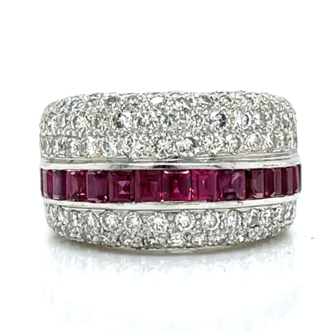 18K White Gold Ruby Diamond Ring 108 Diamonds 15 Rubies: 18K White Gold Ruby Diamond Ring 108 Diamonds 15 Rubies This stunning 18K white gold ring features a captivating combination of rubies and diamonds. It weighs 10.6 grams and is adorned with 108 diamon