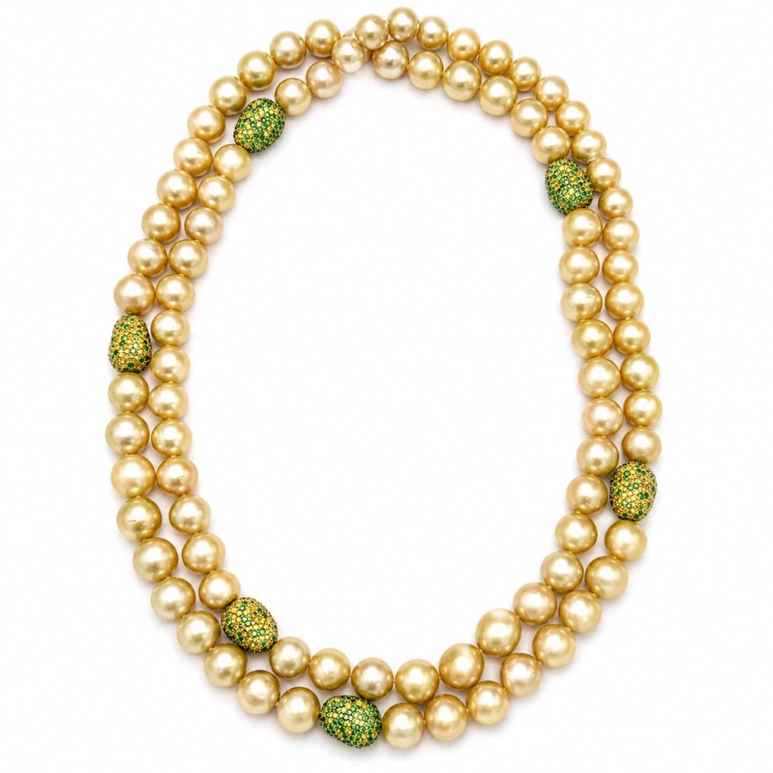 South Sea Pearl Necklace with Yellow Sapphires Garnets in 18K Gold 45 Inch: South Sea Pearl Necklace with Yellow Sapphires Garnets in 18K Gold 45 Inch This necklace features 88 South Sea pearls set in 18K yellow gold, with pearl sizes ranging from 11.0 to 10.3mm. It is furthe