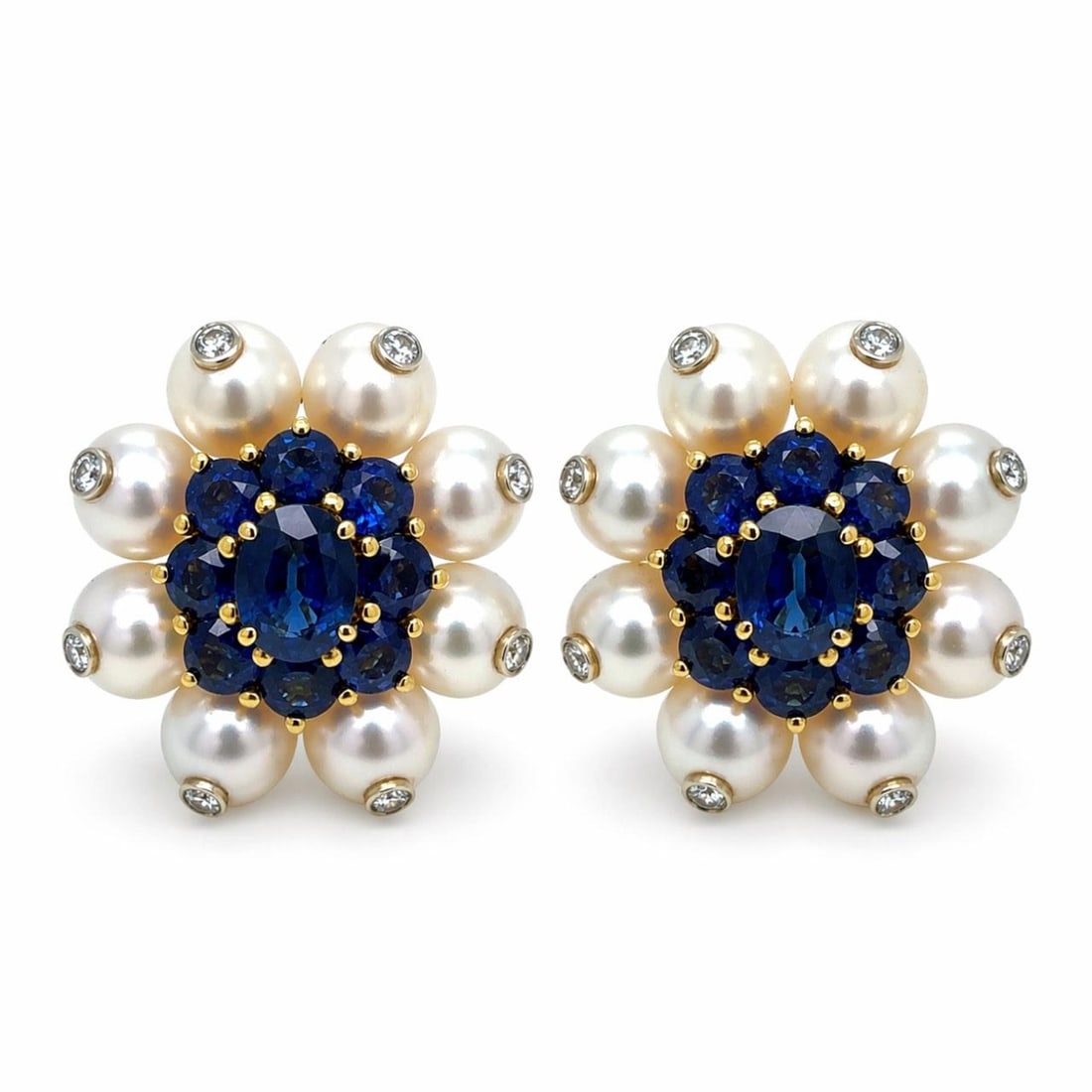 Sapphire Pearl Diamond Earrings in 14K Yellow Gold with 16 Pearls: Sapphire Pearl Diamond Earrings in 14K Yellow Gold with 16 Pearls These pre-owned earrings are crafted from 14K yellow gold and feature a striking combination of 16 pearls, each measuring 7.6mm, 18 sa
