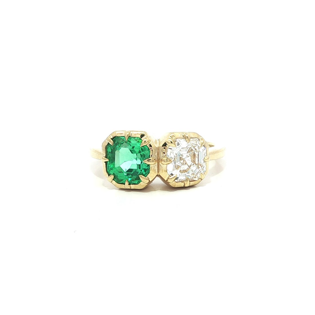 GIA Certified 18k Yellow Gold Toi Et Moi Emerald Diamond Ring: GIA Certified 18k Yellow Gold Toi Et Moi Emerald Diamond Ring This elegant cocktail ring features a natural Colombian emerald and a natural diamond, both certified by GIA. The octagonal step-cut emera