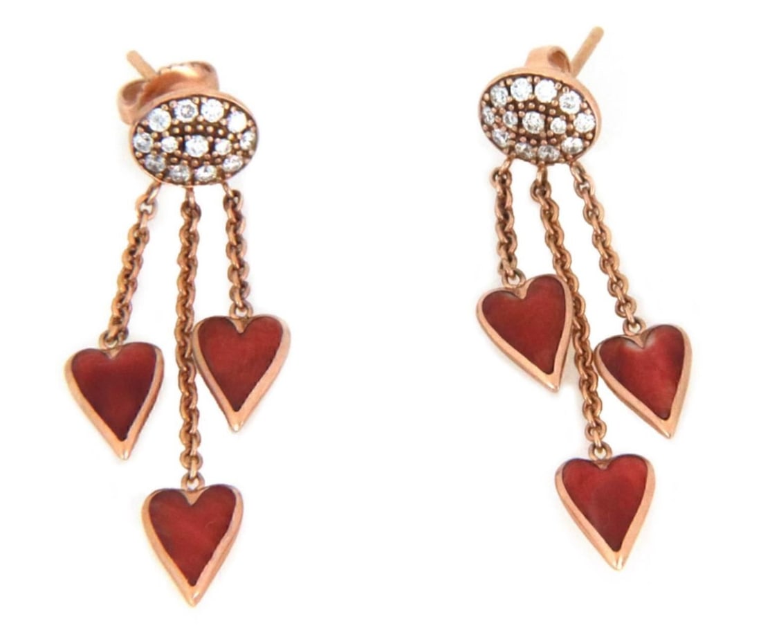 Kabana heart dangle earrings 14k rose gold spiny oyster diamonds: Kabana heart dangle earrings 14k rose gold spiny oyster diamonds These Kabana dangle earrings are crafted from 14k rose gold and feature a distinctive three-heart motif. Each heart showcases vibrant s