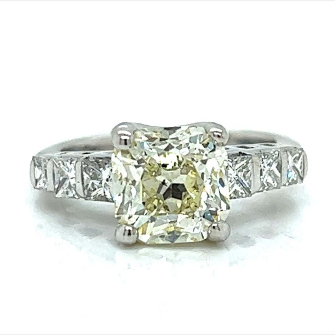 14K White Gold 2.68 Ct Cape Yellow Diamond Engagement Ring: 14K White Gold 2.68 Ct Cape Yellow Diamond Engagement Ring This exquisite 14K White Gold engagement ring features a stunning 2.68 Ct. Cape Yellow Diamond at its center, showcasing SI2 clarity. Flankin